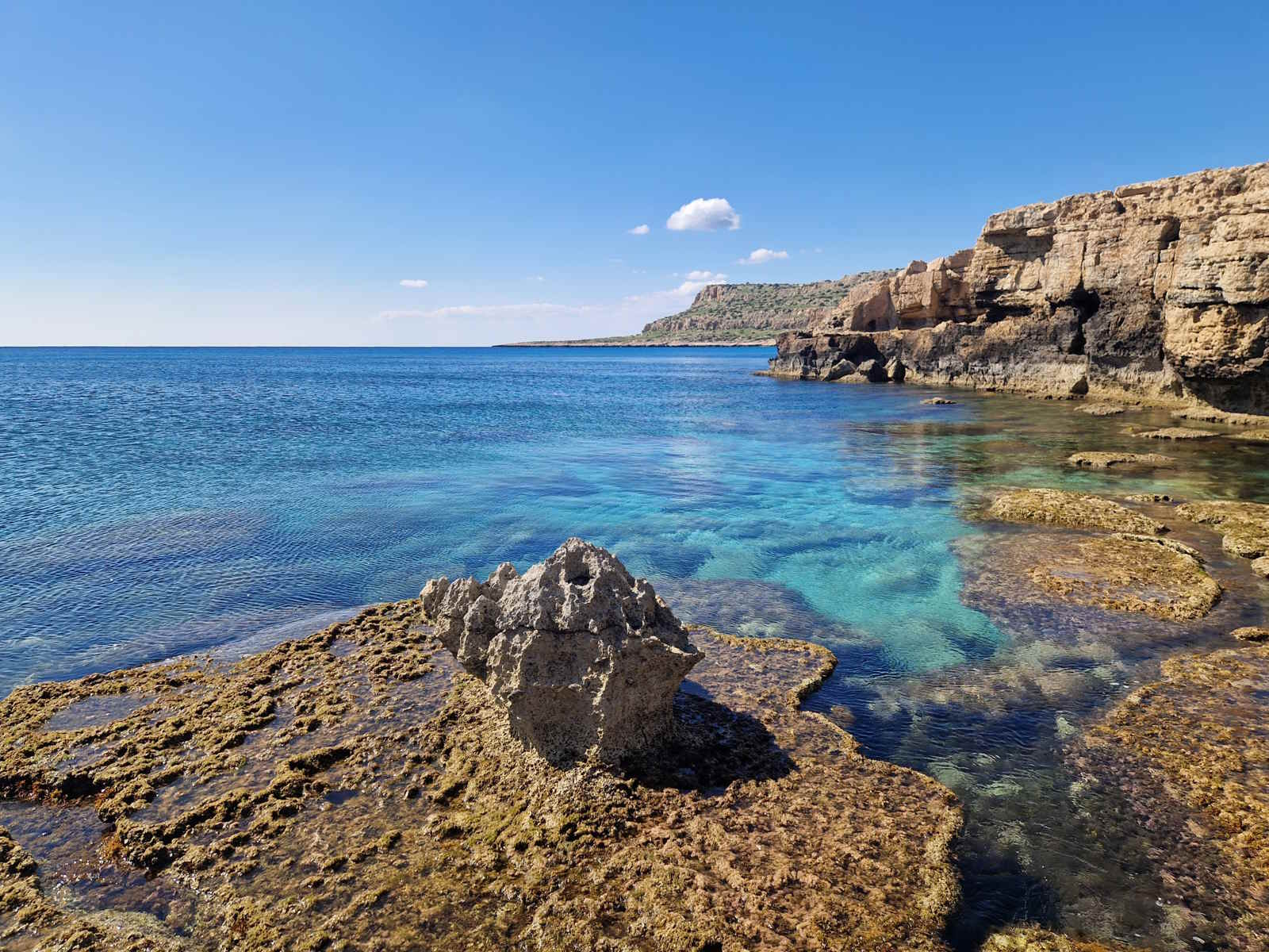 Rocky coastline and clear blue sea at Cape Greco, Cyprus