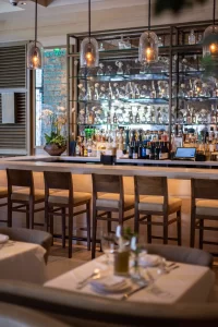 Bar and dining interior at Avra Beverly Hills restaurant in Los Angeles