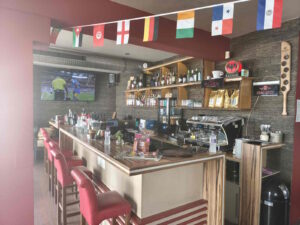 Close-up view of the bar area at All Time Lounge Cafe in Leonberg with beverage selection and café lounge setting.