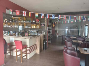 Close-up view of the bar area at All Time Lounge Cafe in Leonberg with beverage selection and café lounge setting.