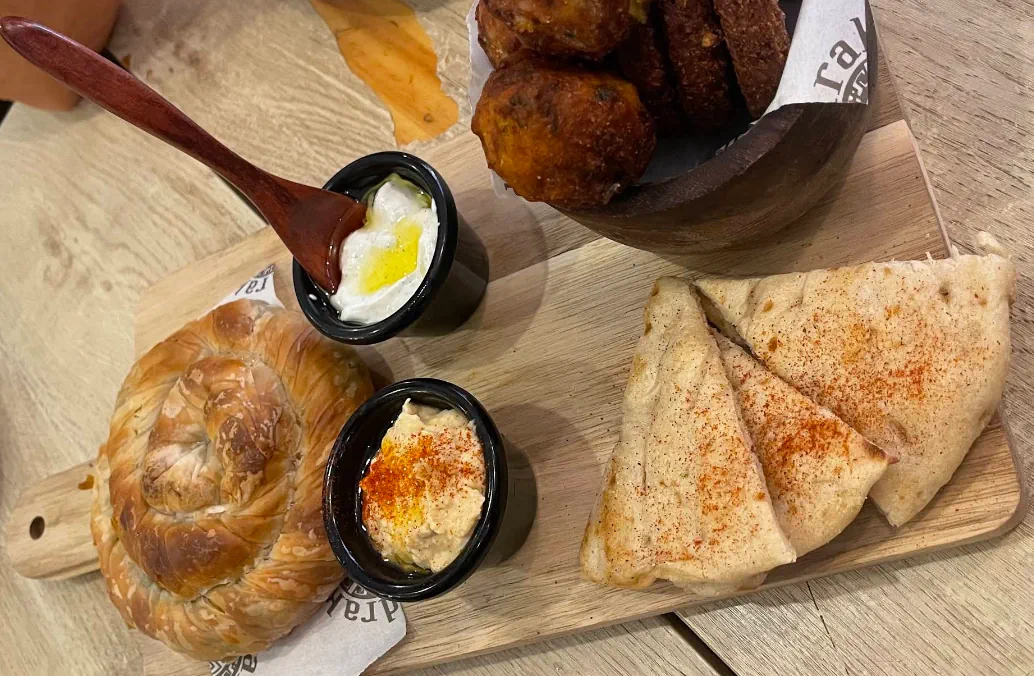 Greek meze platter with pastry, dips, pita bread and fried bites served at Mandrake
