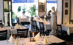Dining room with set tables inside Akropolis restaurant
