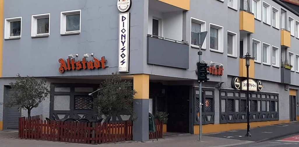 Street-level exterior and entrance of Dionysos Greek restaurant