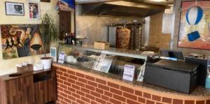 Service counter and open gyros preparation area inside Gyros Artemis