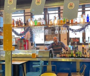 Bar counter with drinks display and seating inside Hamburg Exargia