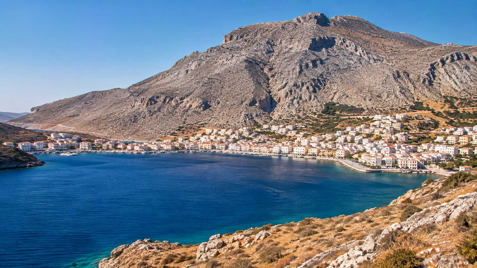 Coastal town and rugged mountain landscape in Kalymnos, Greece