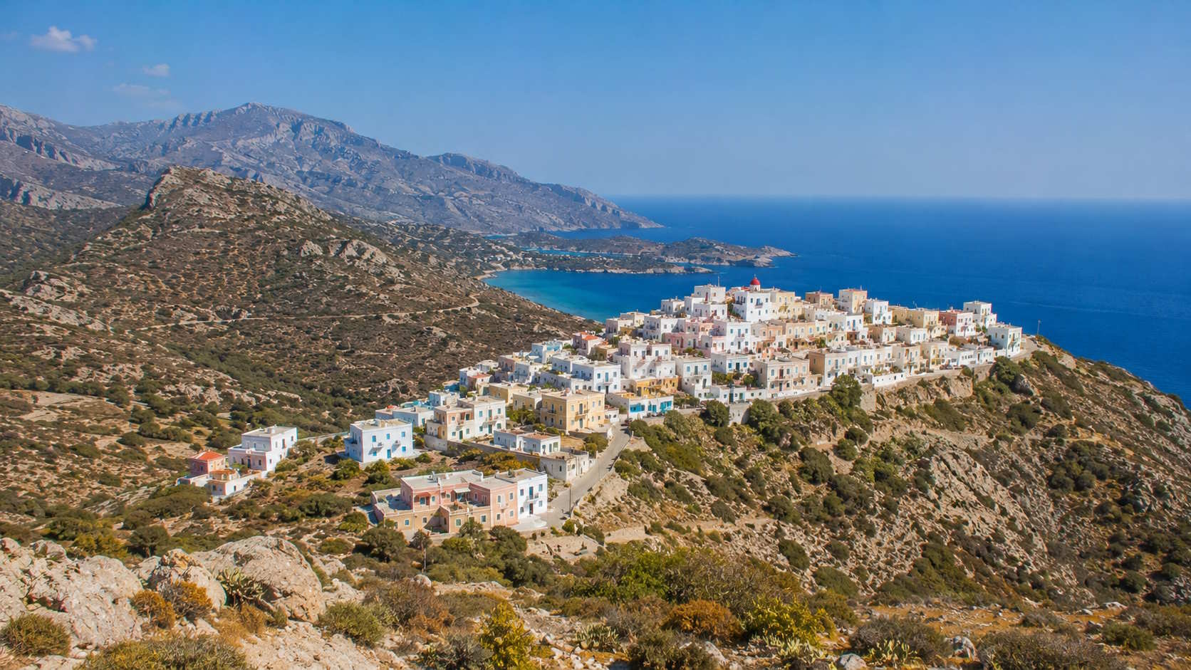 Traditional hillside village and Aegean Sea landscape in Karpathos, Greece