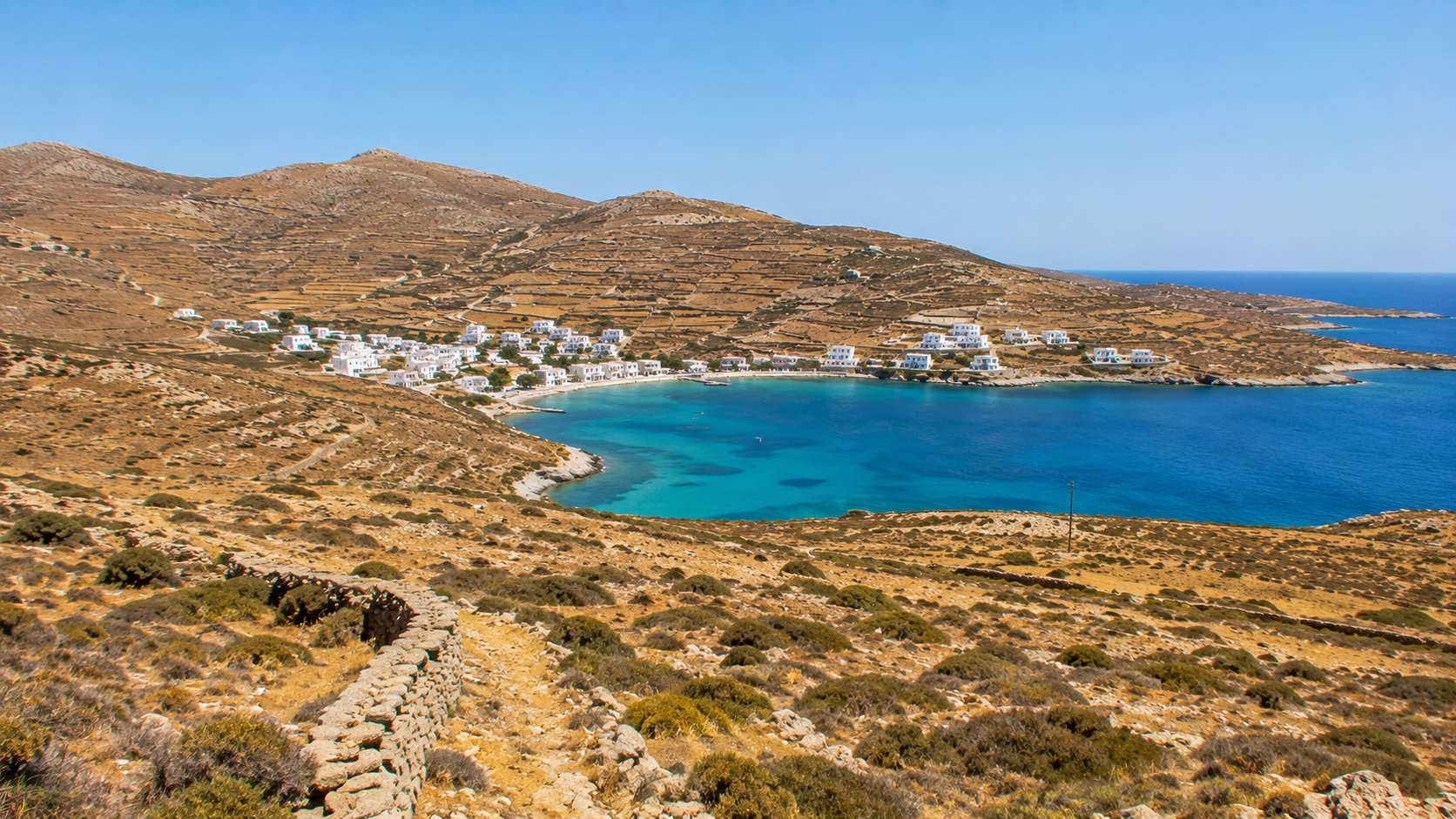 Traditional coastal village and turquoise bay on Kythnos island, Greece