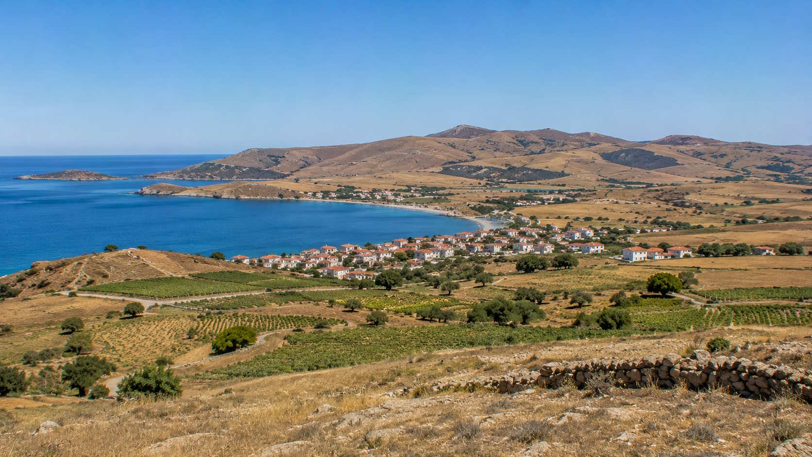 Coastal village, farmland and Aegean bay on Lemnos island, Greece