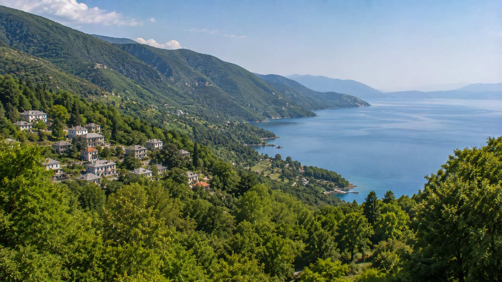 Forested Pelion mountains and traditional village overlooking the Pagasetic Gulf in Magnesia, Greece