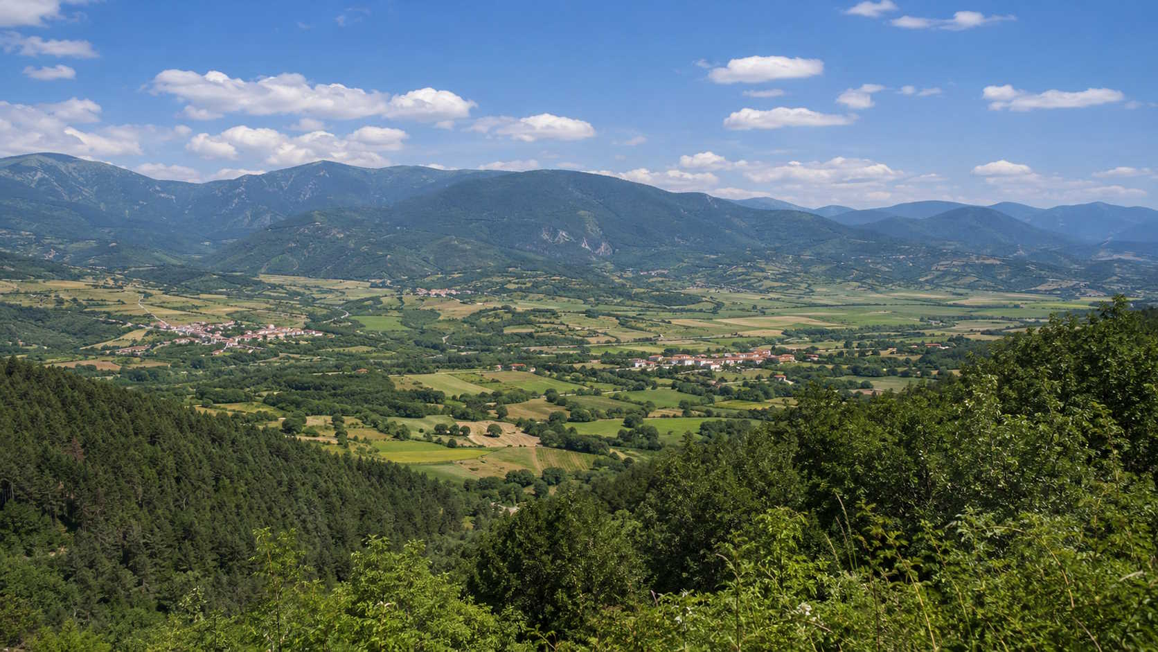Green valley and forested mountains in Rhodope, northern Greece