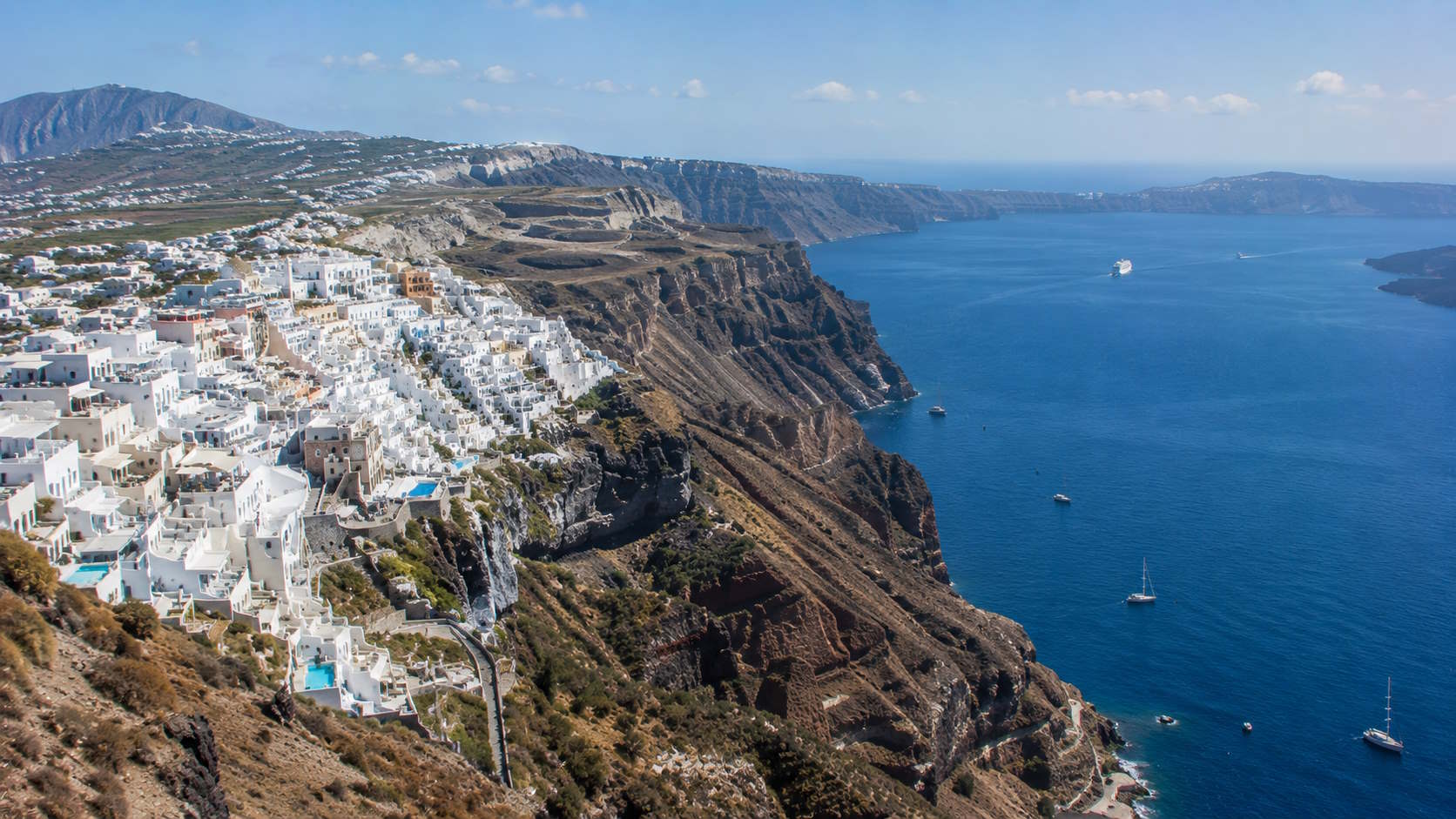 Whitewashed settlement on the volcanic caldera cliffs of Santorini, Greece