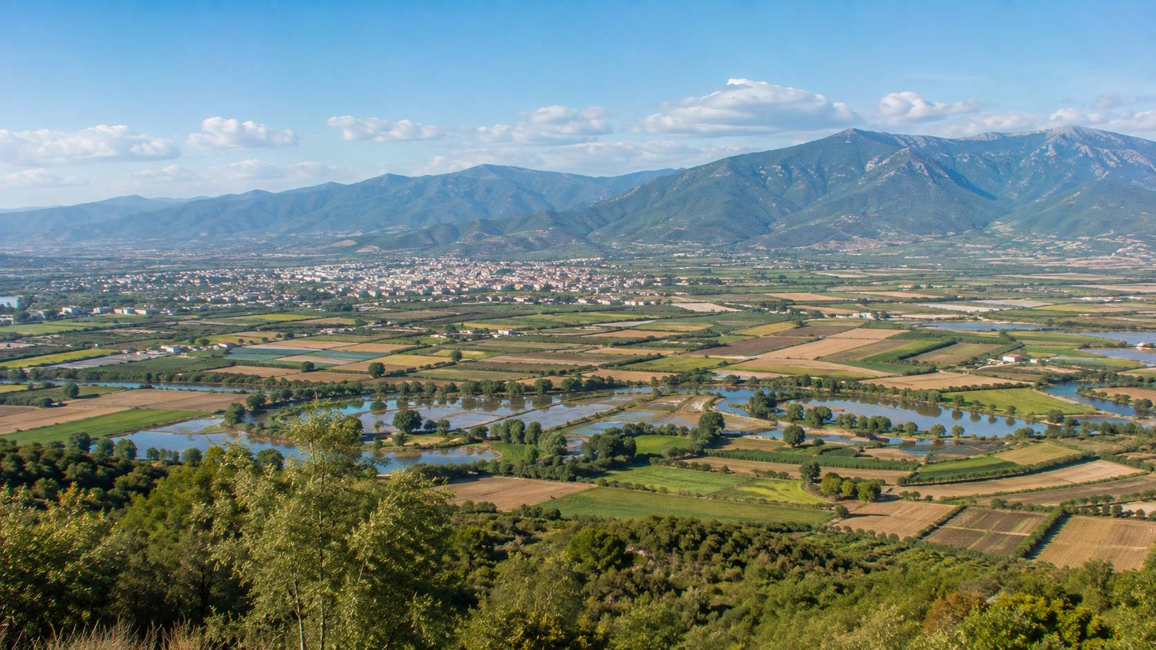 Fertile Serres plain with farmland, wetlands and mountains in northern Greece