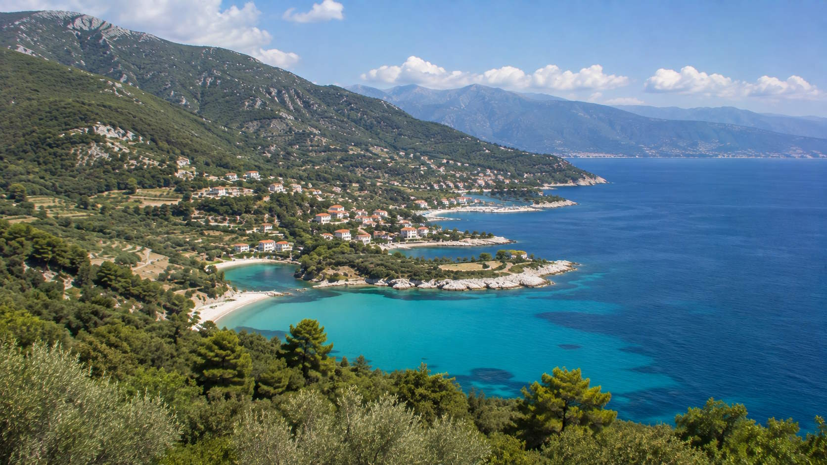 Green mountainous coastline with turquoise bays on Thassos island, Greece