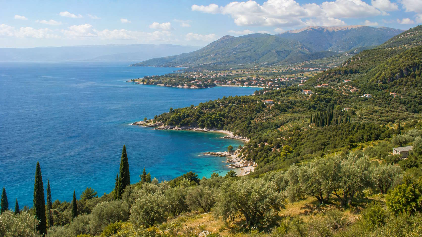Green Ionian coastline, olive groves and mountains in Thesprotia, Greece