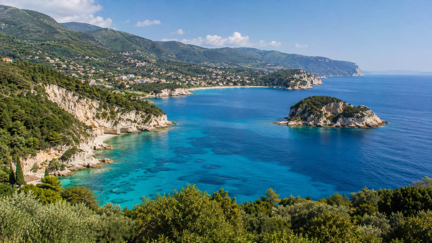 Turquoise Ionian coastline with limestone cliffs and green hills in Zakynthos