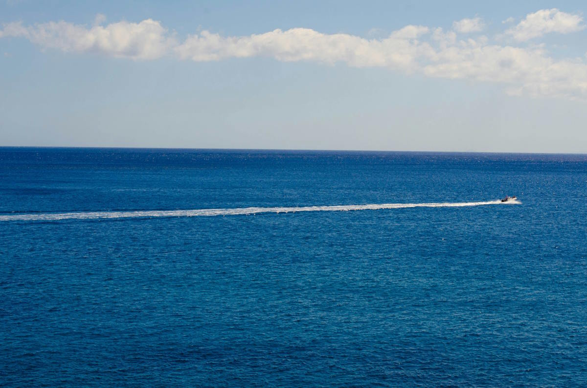 Deep blue Mediterranean Sea and horizon view from the Greek coastline