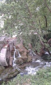 Krya Springs with historic waterwheel and flowing water in Livadia, Central Greece