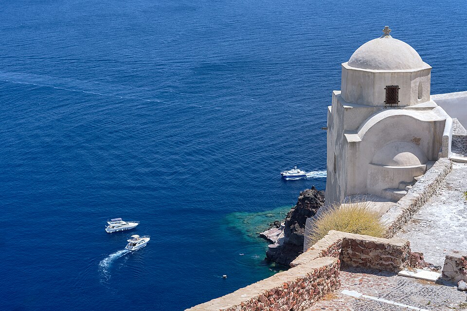 Traditional Cycladic church overlooking the Aegean Sea in Santorini, Cyclades, Greece