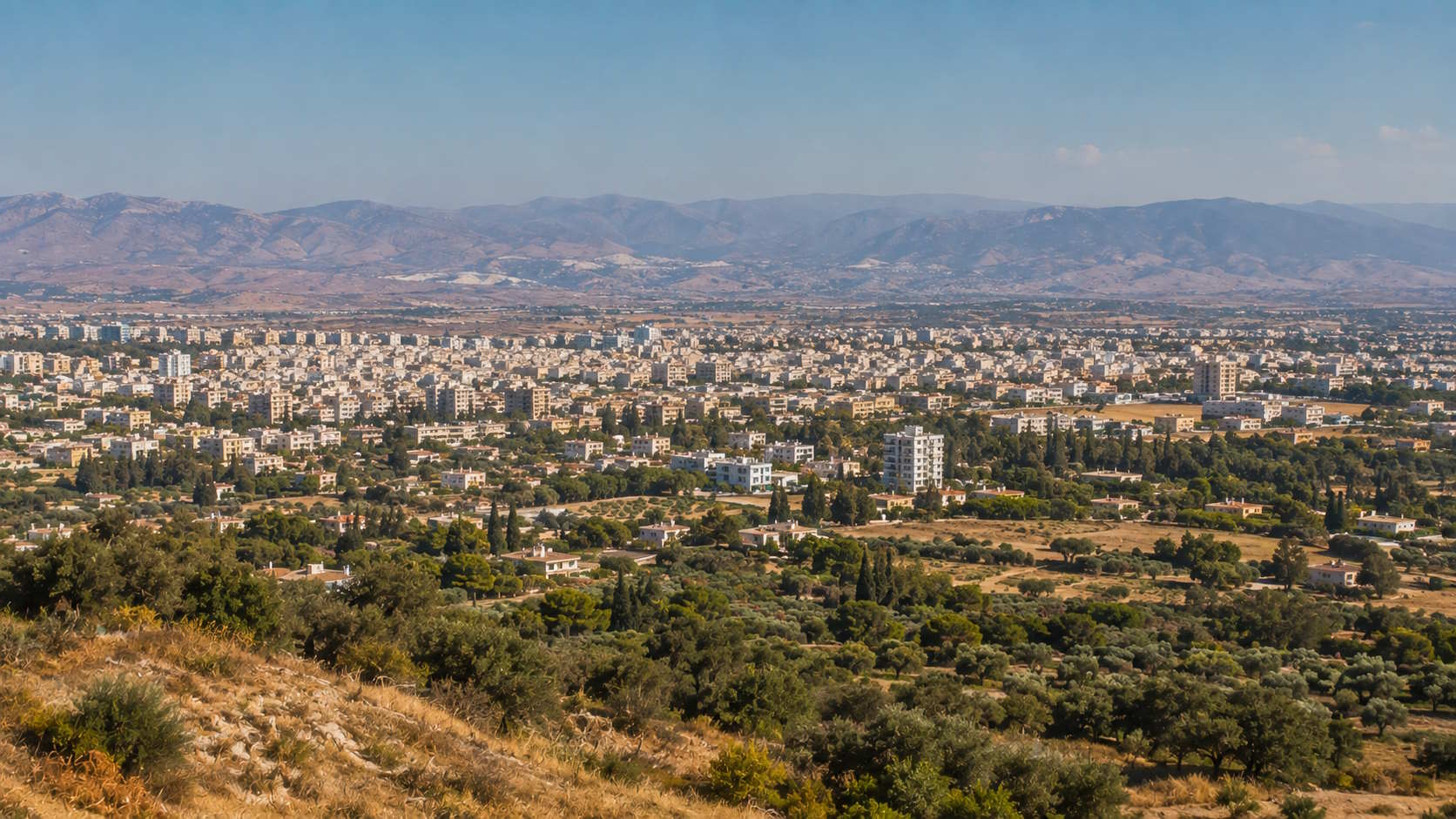 Nicosia urban landscape surrounded by Mediterranean countryside and mountains in Cyprus