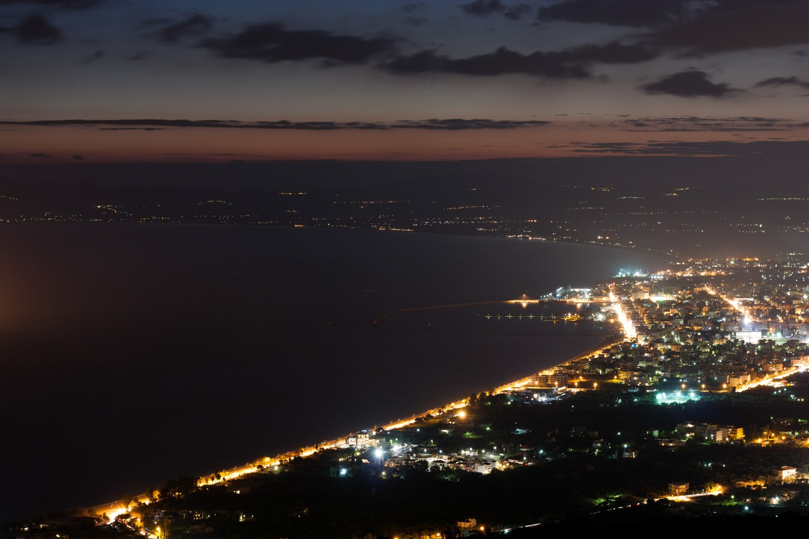 Panoramic night view of Kalamata and the coastline of the Peloponnese, Greece