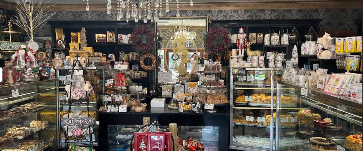 Interior of Athena Cake Shop displaying traditional Greek sweets and cakes
