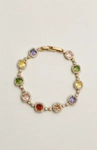 Gold-tone bracelet with multicoloured stones and clear decorative accents