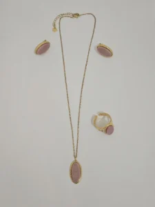 Gold-tone necklace, ring and earrings with oval pink details