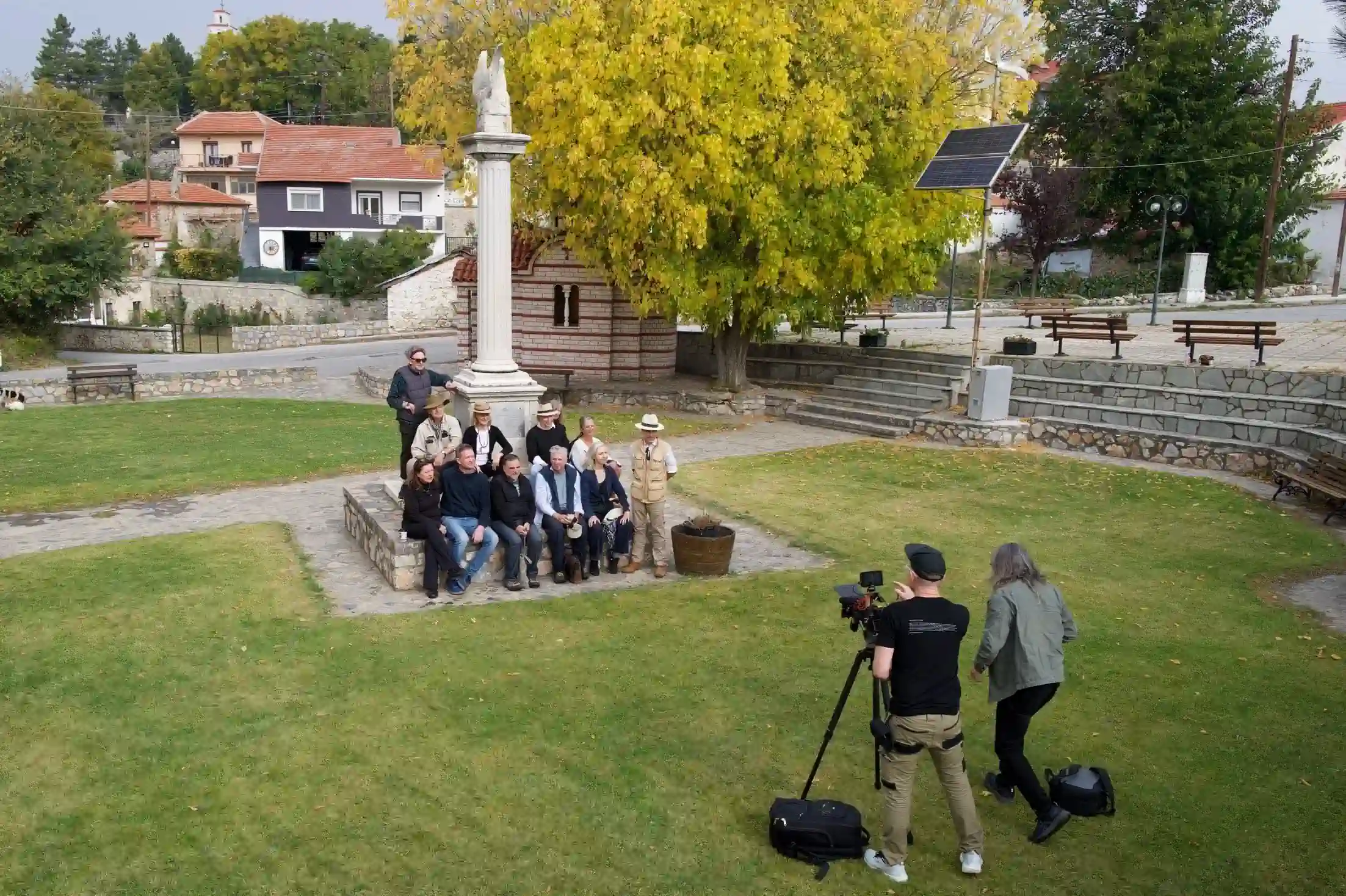 Artists and film crew gathered at a historic site during the LUSTRE project journey through Greece